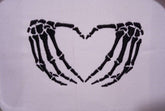 Spooky embroidered skeleton hands artwork